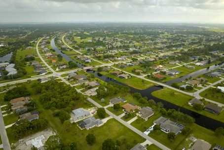 Aerial view of small town America suburban landscape with private homes between green palm trees in Florida quiet residential area stock photo