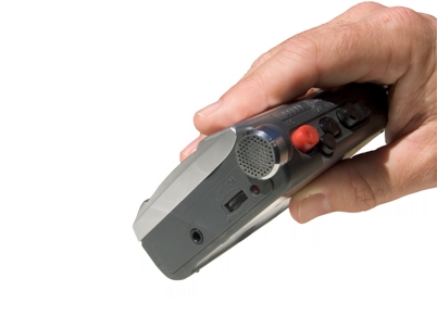 male hand holding a tape recording device