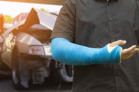 men wear cloth splint on arm to treat car accident injuries. stock photo