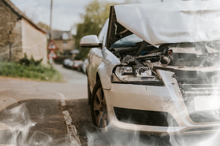 Wrecked car parked on the street after a car crash stock photo
