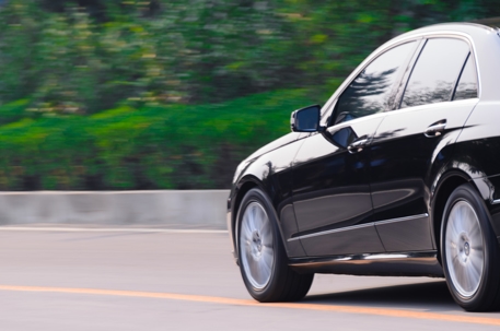Black benz running up the mountain road