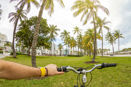 POV Point of view shot of a young sport man riding a bicycle at Ocean Drive, South Beach, Miami Beach, Miami, South Florida, United States of America stock photo