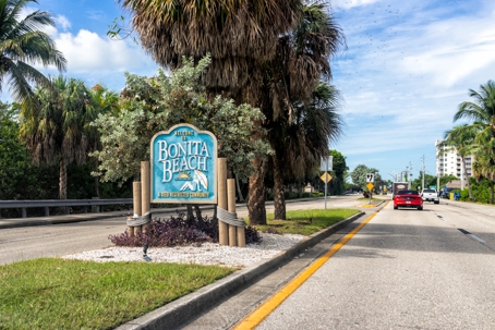 Pov car driving on Bonita Beach Road Florida state road 865 to Bonita Beach with welcome sign in Lee county