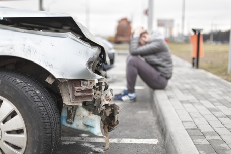 Broken car after the accident in foreground stock photo
