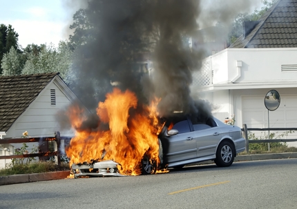 Car on fire stock photo