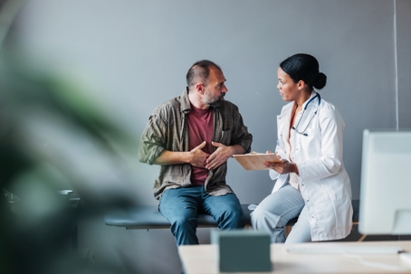 Doctor and Patient Engaged in a Medical Consultation in Modern Clinic stock photo
