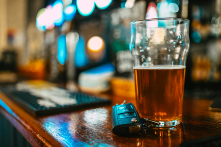 Beer and car keys at the bar counter, drunk driving concept stock photo