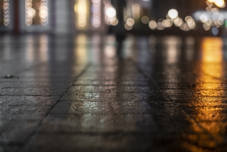 Night urban landscape, colored lights reflected in the wet asphalt in fall. Rainy night street in the city. The lights of a rainy night in the autumn city of disfocus and bokeh. Neon street illumination after rain. stock photo