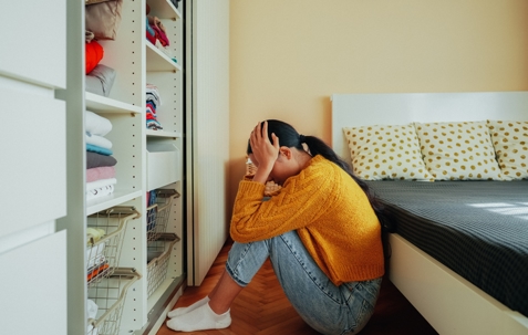 Depressed girl at home stock photo