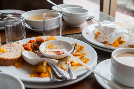 dirty plates on a table at a restaurant