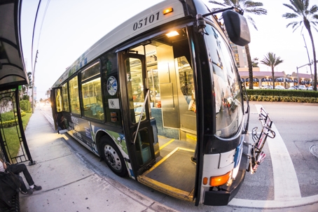 People in the downtown Metro bus in Miami, USA. Metrobus operates more than 90 routes with close to 1,000 buses covering 41 million miles per year. stock photo