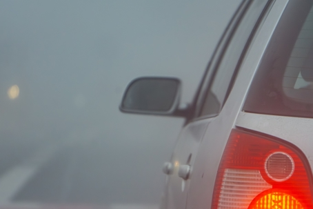 Cold, damp foggy morning. danger on the road, poor visibility in road traffic, bad weather