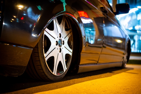 The car is parked on a night street close-up