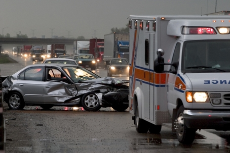Highway car accident scene and ambulance