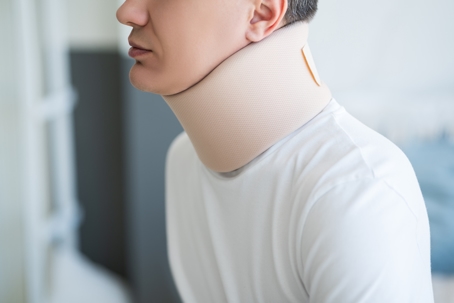 Man wearing a neck brace