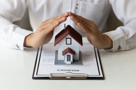 The concept of contracting a home insurance agreement. stock photo