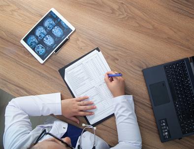 Doctor is making notes stock photo