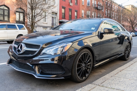 2014 Mercedes Benz E550 luxury car parked outside, corner view stock photo
