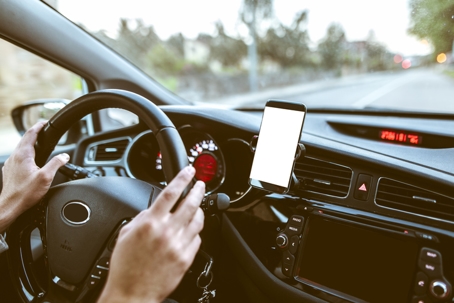 Mobile phone inside car stock photo