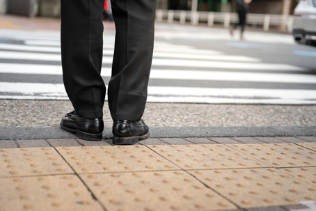 A businessman is waiting to crossing the road. stock photo