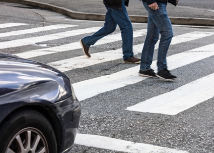 Pedestrian crossing and car at crossroads stock photo