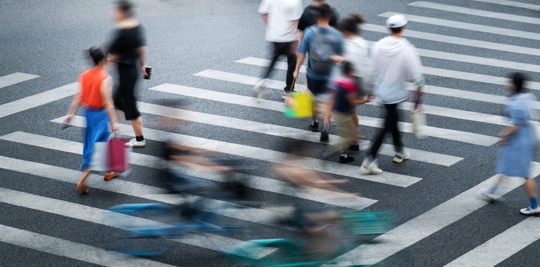Crowd of people walking on crosswalk stock photo