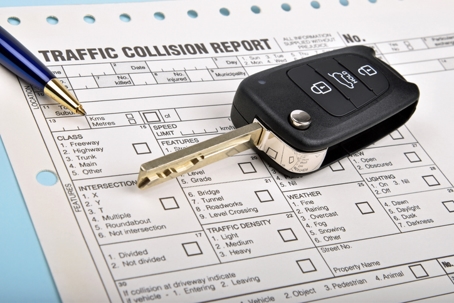Car key and crash report stock photo