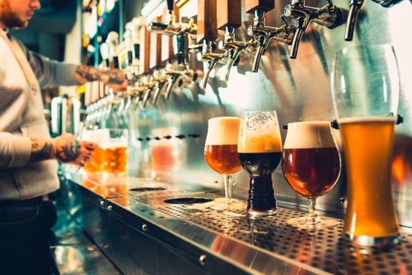 Bartender Pouring Beers at a Bar