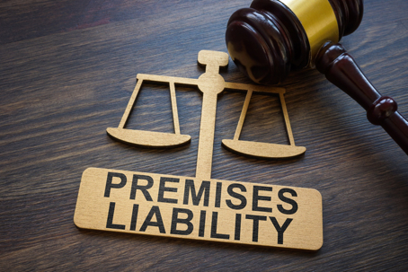 Search by image or video Plate with inscription Premises liability and gavel. stock photo