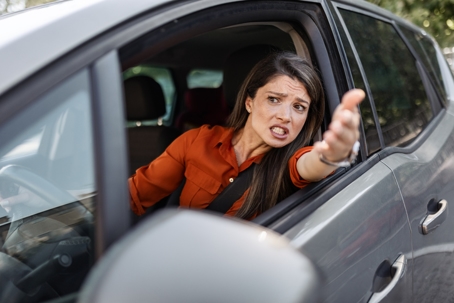 Angry woman driver in traffic jam