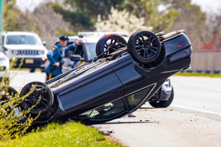 Vehicle rollover highway road accident with police stock photo