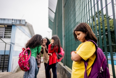 Schoolgirl suffering bullying on school stock photo