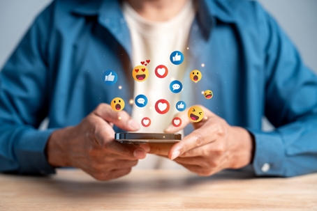 Social media, digital content, smartphone, emoji, reaction, like, comment, engagement, viral content, online communication, mobile app, influencer marketing, social network. stock photo