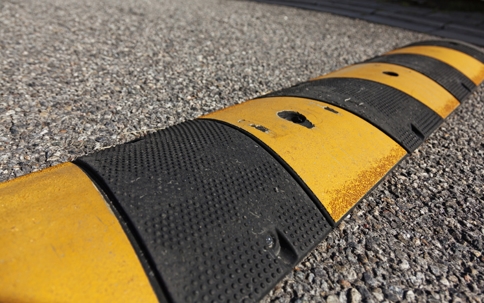 Black and yellow speed bumps stock photo