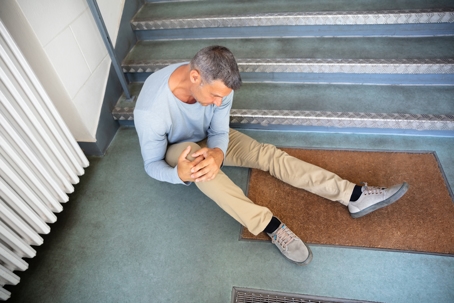 Mature Man Sitting On Staircase stock photo