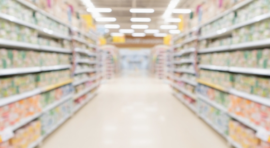 Supermarket store aisle interior abstract blurred background