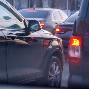 Cars standing in a traffic jam on city street