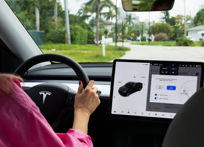 Cockpit with LCD touch screen of electric car Tesla Model Y during drive. stock photo