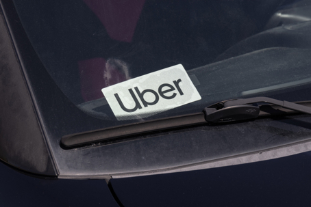 Search by image or video Uber Car for hire sticker. Lyft and Uber have replaced many Taxi cabs for transportation with a smart phone app. stock photo