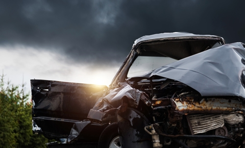 A car shattered in a car accident stock photo