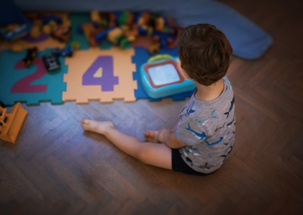 little boy playing with toys